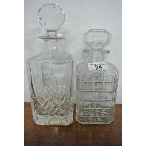 94 - Two antique cut glass decanters.