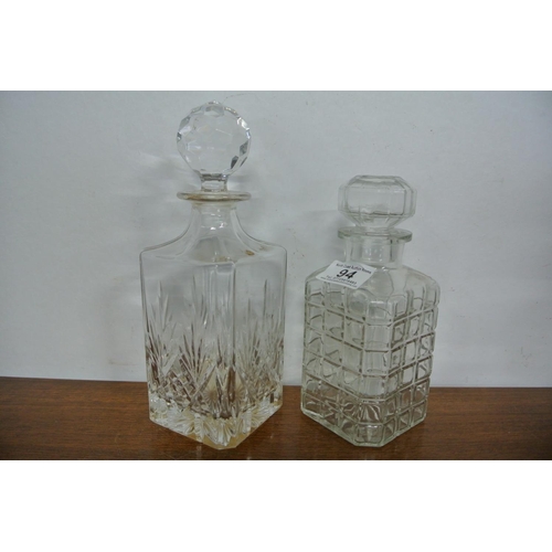 94 - Two antique cut glass decanters.