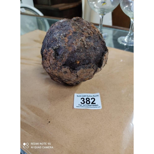 382 - An antique cannonball.