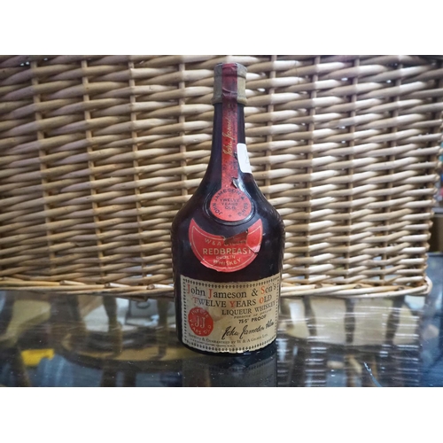 831 - A vintage bottle of John Jameson & Sons 12 Year Old Redbreast Irish Whiskey.