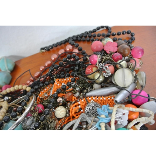 107 - A large assortment of costume jewellery.