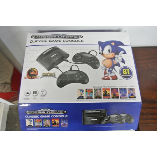 147 - A retro Sega Mega Drive along with assortment of retro controllers to include joy sticks, super Nint... 