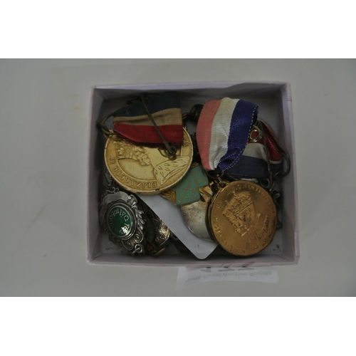 177 - A collection of medals and badges.