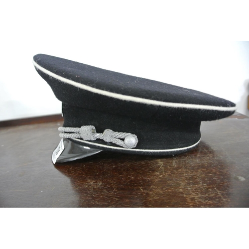 194 - A reproduction WW2 era German Officer cap along with what is believed to be a original chin strap.