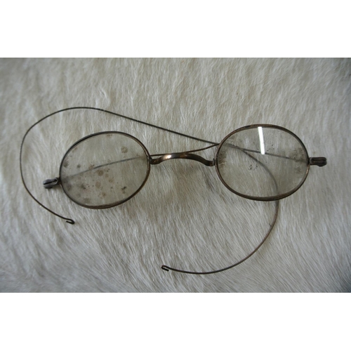 198 - Two pairs of antique eye glasses.