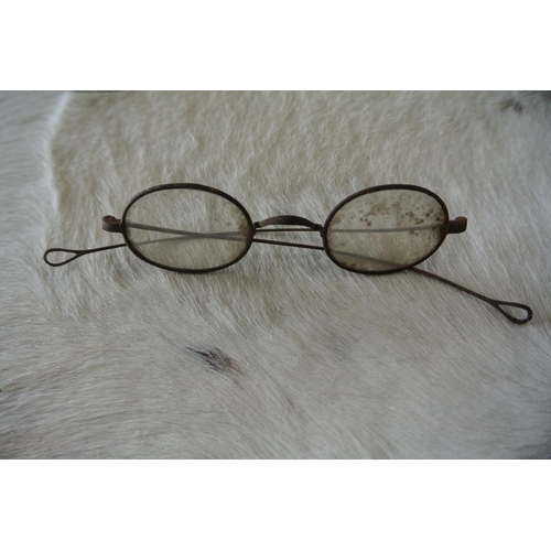 198 - Two pairs of antique eye glasses.