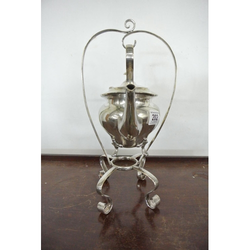 202 - An antique silver plated spirit kettle (lacking burner).