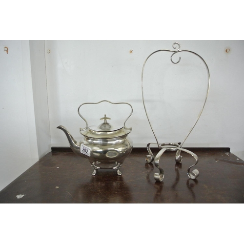 202 - An antique silver plated spirit kettle (lacking burner).