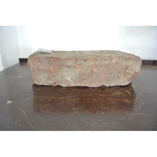 203 - A brick from the Berlin Wall.