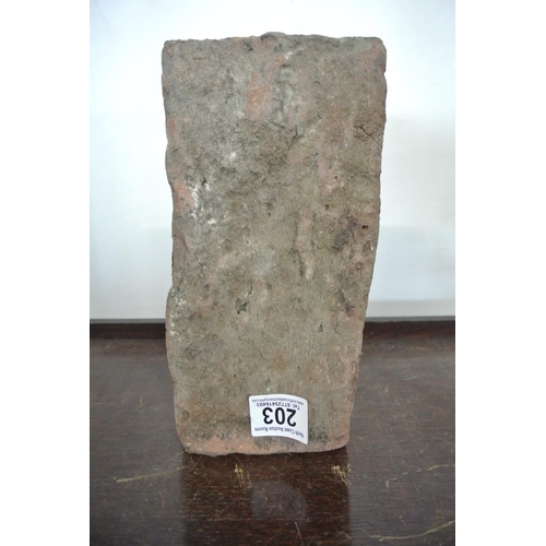 203 - A brick from the Berlin Wall.