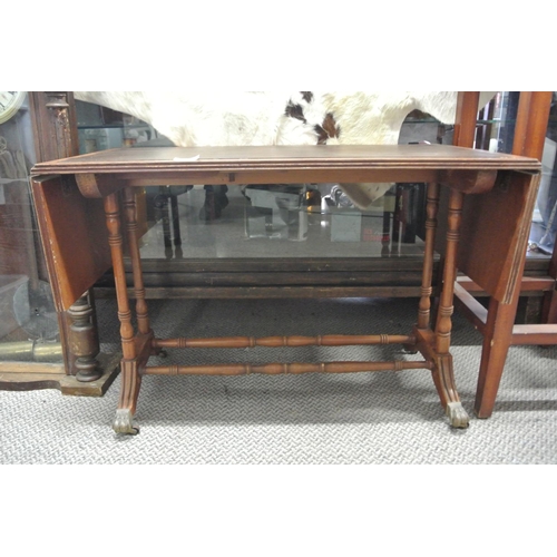 211 - A vintage leather top drop leaf coffee table.