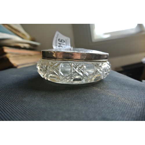 216 - An antique crystal trinket dish with sterling silver lid, fully hallmarked for Birmingham.