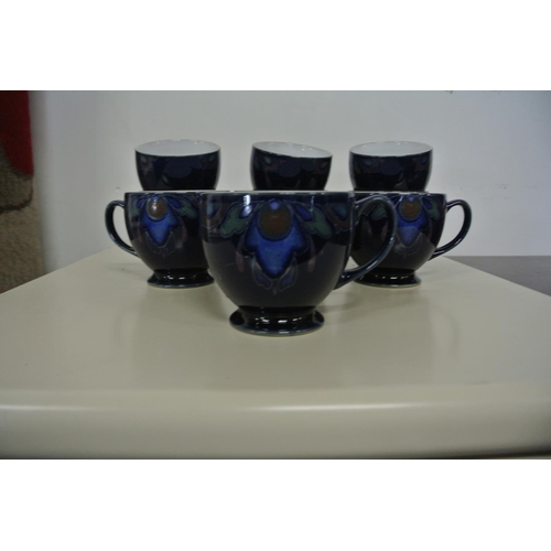 223 - A stunning collection of Denby ceramics to include eleven tea cups, a butter dish, ten plates and a ... 