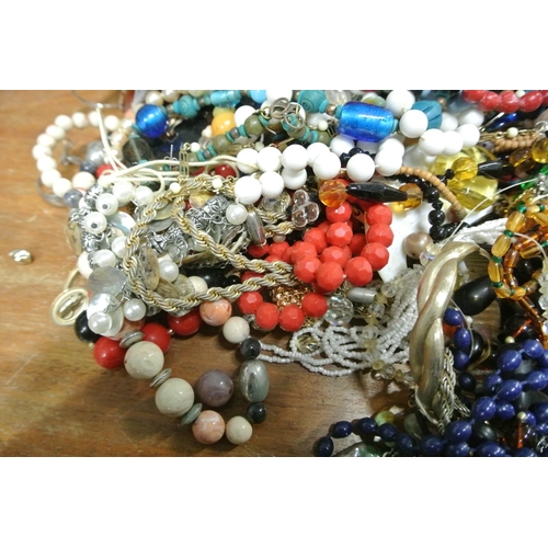 23 - A large assortment of costume jewellery.