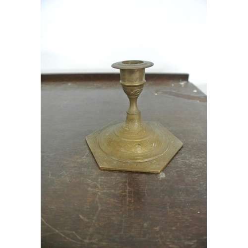 234 - An assortment of brass items to include a stunning three tier candelabra, three other candle sticks ... 