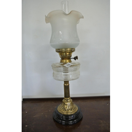 239 - A Victorian style oil lamp on decorative brass pillar, clear glass reservoir, and etched glass shade... 