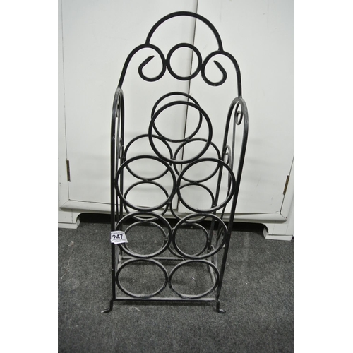 247 - A metal wine rack.