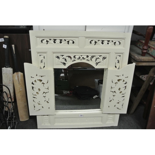 248 - A vintage highly decorative framed mirror.