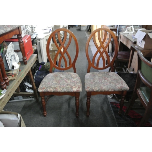 249 - A set of five dining chairs.