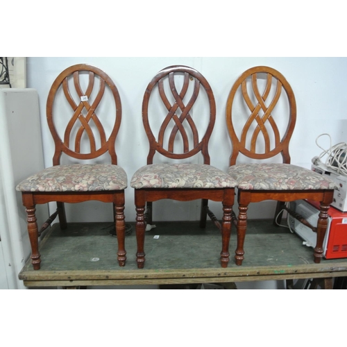 249 - A set of five dining chairs.