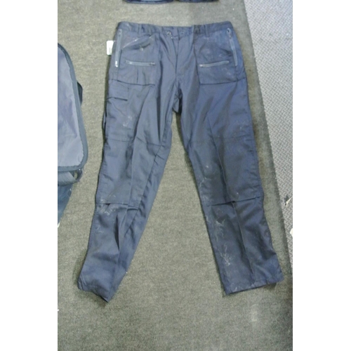 250 - A Super Champion boiler suit along with a pair of Blue Castle workman's trousers.