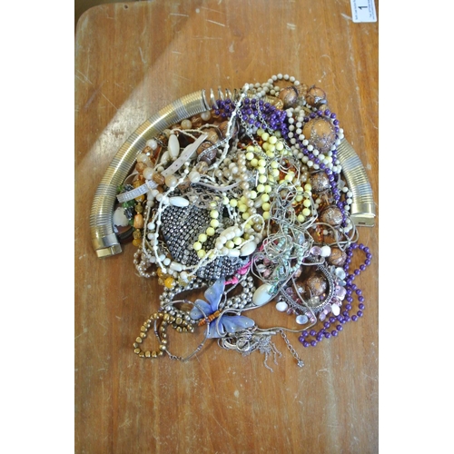 267 - A large assortment of costume jewellery.