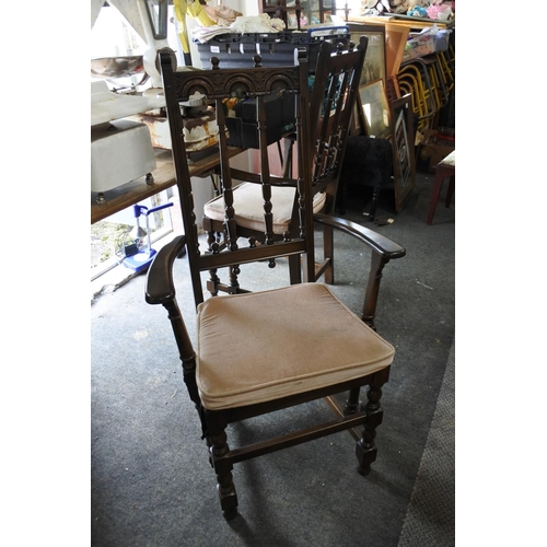 309 - A pair of Ercol carver dining chairs.