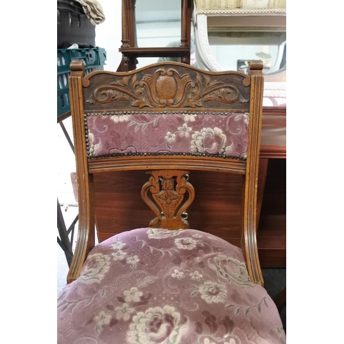 316 - A stunning pair of antique chairs with decoratively carved splats.