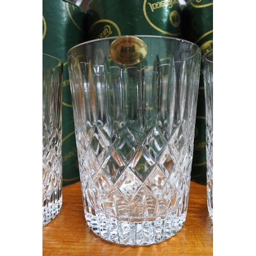 375 - A stunning set of four Tyrone crystal glasses complete with original packaging.