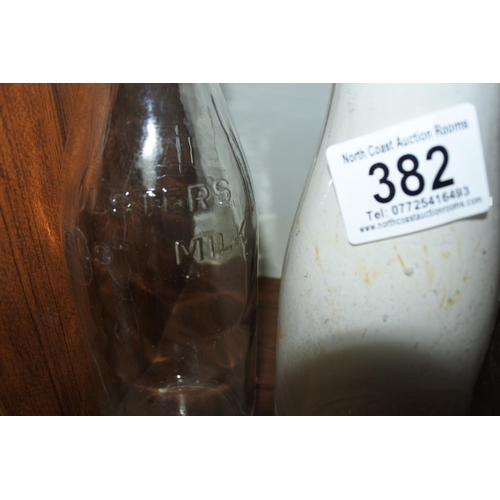 382 - A collection of three vintage milk bottles to include 'WHITEROCK DAIRIES PORTRUSH', 'ULSTER'S BEST M... 