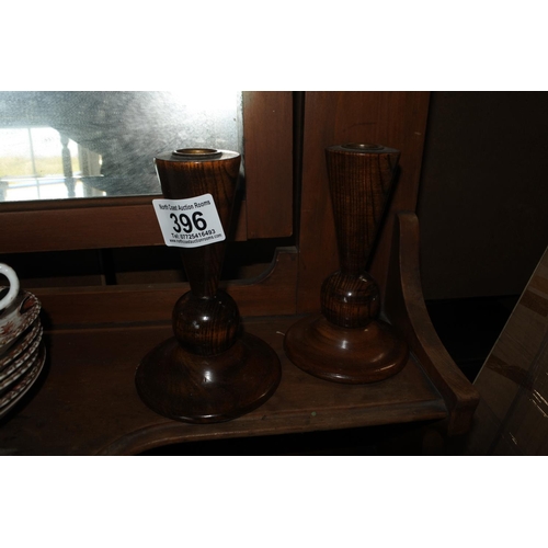 396 - A pair of vintage wooden candlesticks.