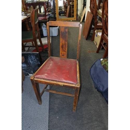 403 - A vintage chair with red seat.