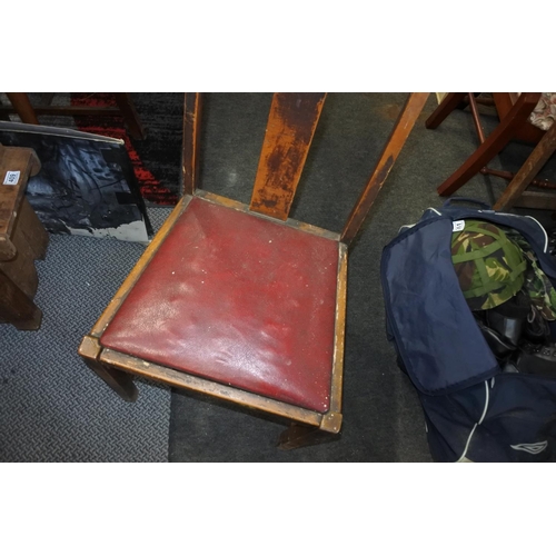 403 - A vintage chair with red seat.