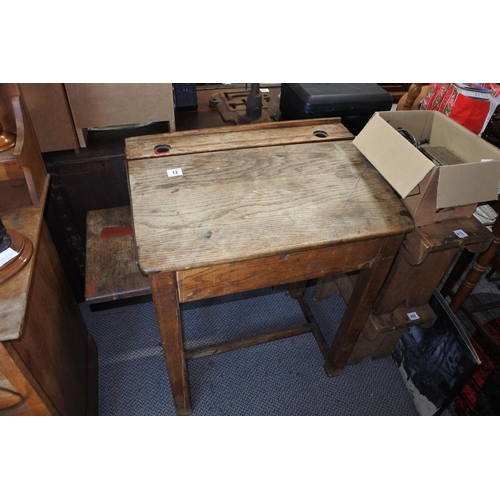 404 - A traditional lift top lid school desk with two built-in inkwell holders.