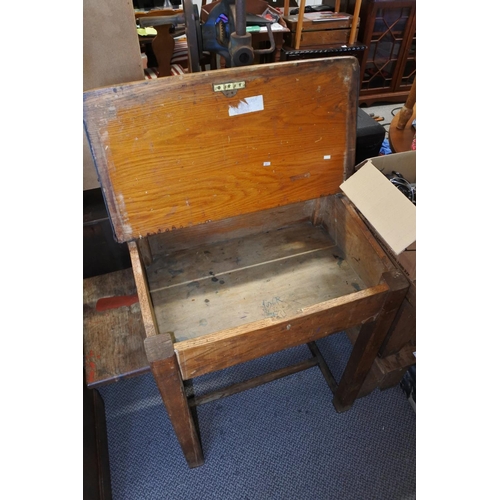 404 - A traditional lift top lid school desk with two built-in inkwell holders.