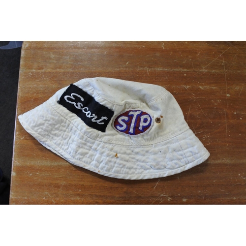 414 - A retro bucket hat with badges stitched on, to include 'STP', Escort', and more.