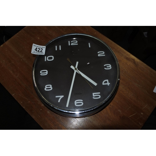 422 - A German quartz wall clock produced by Kienzle.