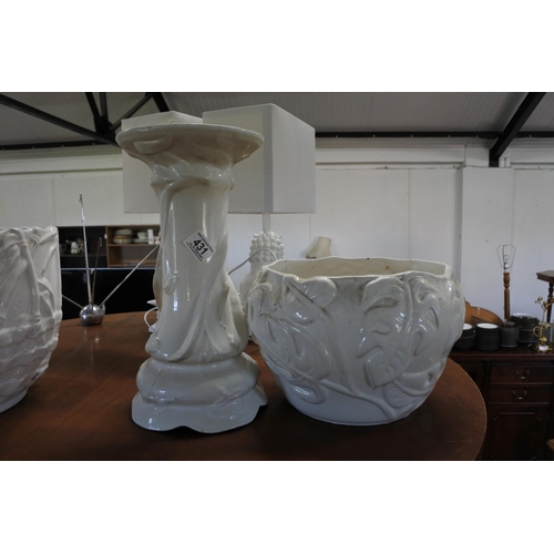 431 - A vintage ceramic jardiniere and stand with floral details.