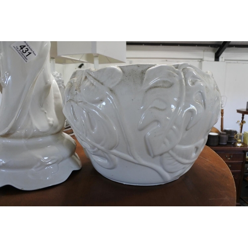 431 - A vintage ceramic jardiniere and stand with floral details.