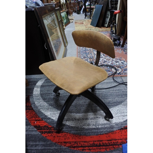 432 - A vintage Tansad swivel chair on castors.