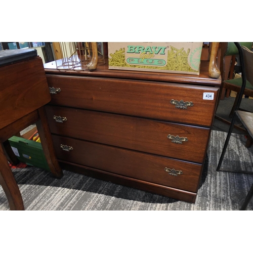 434 - A vintage chest of drawers with decorative metal fittings.