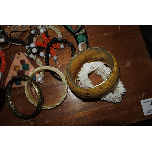 443 - An assortment of costume jewellery.