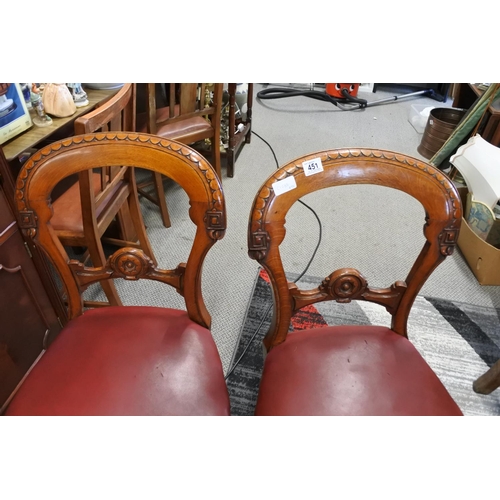 451 - A stunning pair of antique chairs with decorative splats and red leather upholster.