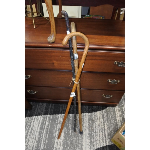 452 - Three antique / vintage walking sticks to include a blackthorn stick, a stick with a metal collar an... 