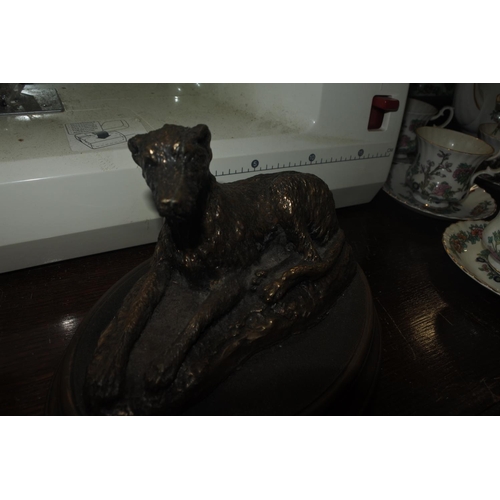 65 - A small bronze effect Irish Wolf Hound statue.