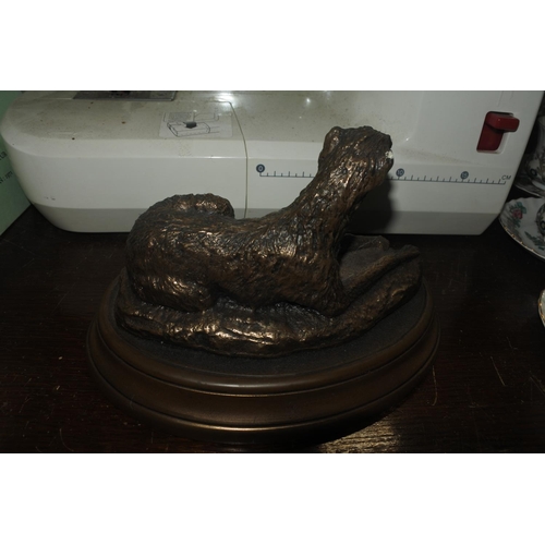 65 - A small bronze effect Irish Wolf Hound statue.