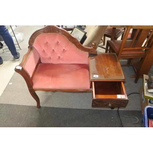 86 - A retro telephone table with decorative detailing.