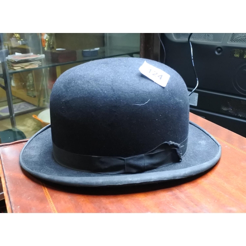 124 - A vintage top hat along with a bowler hat.