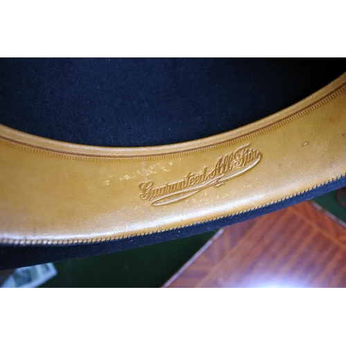 124 - A vintage top hat along with a bowler hat.