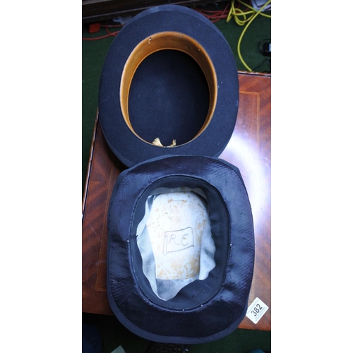 124 - A vintage top hat along with a bowler hat.